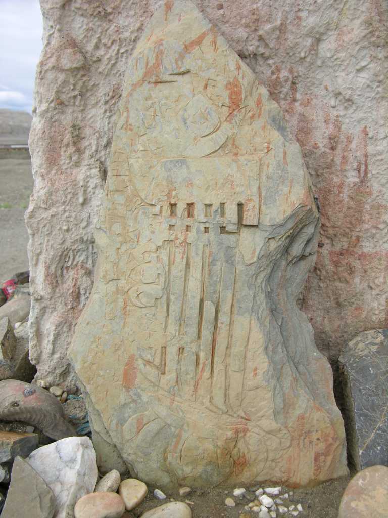 Tibet Guge 04 Tholing 10 Chorten 4 Kalachakra Rock Carving Standing against the fourth chorten is this rock carving called Tenfold Powerful One, symbolizing the Kalachakra Tantra.